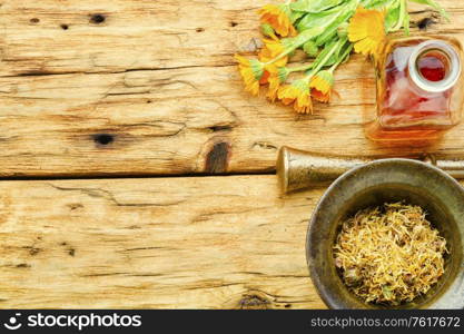 Medicinal tincture of calendula flowers healing herbs in alternative medicine. Calendula healing herbs