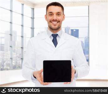 medicine, advertisement and people concept - smiling male doctor showing tablet pc computer blank screen over white room background