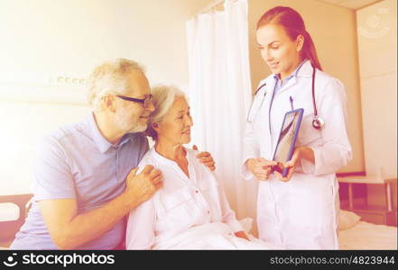 medicine, age, health care and people concept - senior woman, man and doctor with tablet pc computer at hospital ward