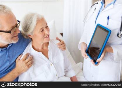 medicine, age, health care and people concept - senior woman, man and doctor with tablet pc computer at hospital ward