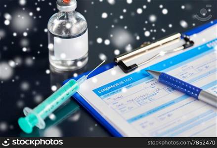 medicine and healthcare concept - close up of clipboard with medical report, pen, syringe and drug on table in winter over snow. medical report, pen, syringe and medicine