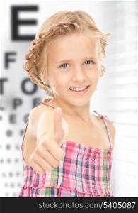 medicine and vision concept - girl with optical eye chart