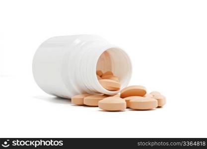 medicine bottle and pills over white background