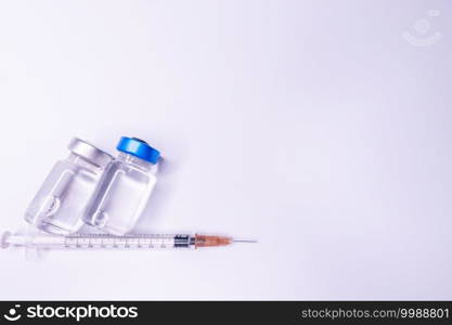 Medicine bottle for injection. Medical glass vials and syringe for vaccination. liquid drug or vaccine for treatment, flu in laboratory, hospital or pharmacy concept isolated on white background.