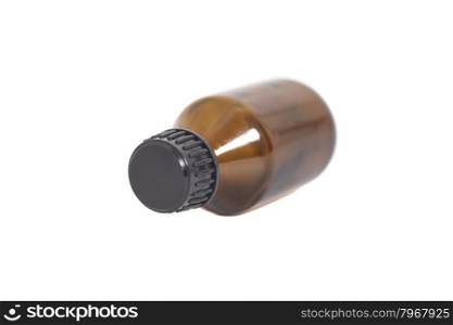Medicine bottle of brown glass isolated on white