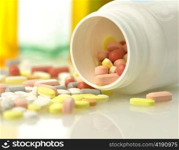 Medicine bottles and pills close up