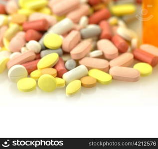 Medicine bottles and pills close up