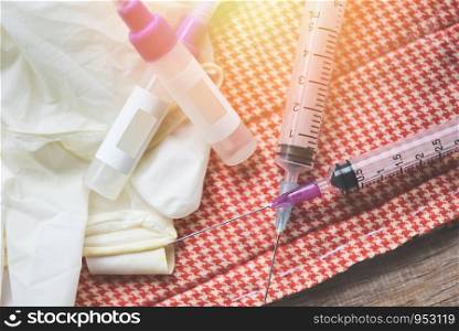 Medicine bottles and syringe injection needle on white background / Medication drug bottle equipment medical tool for nurse or doctor