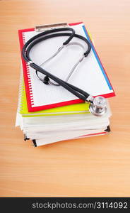 Medicine concept with stethoscope and books