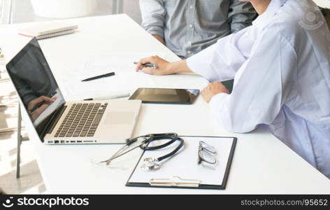 medicine doctor explain diagnosis to doctor team holding and showing clipboard exploring important document