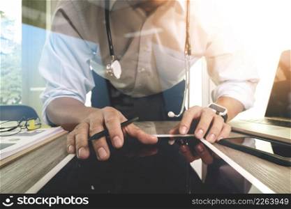 Medicine doctor hand working with modern computer interface and digital tablet computer as medical network concept