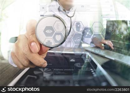 Medicine doctor hand working with modern digital tablet computer with stethoscope as medical network concept