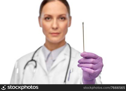 medicine, health and coronavirus concept - close up of female doctor with cotton swab. close up of female doctor with cotton swab