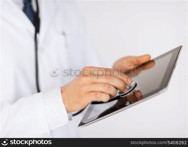 medicine, health and hospital concept - close up of male doctor with stethoscope and tablet pc