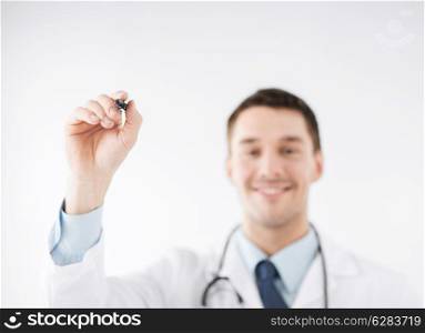 medicine, health and hospital concept - doctor writing something in the air with marker