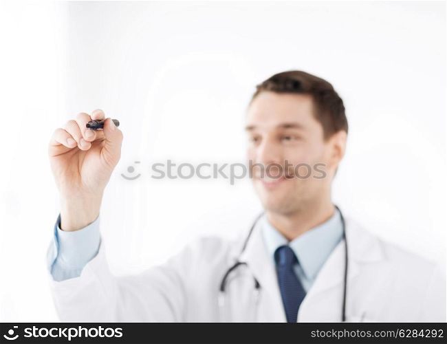 medicine, health and hospital concept - doctor writing something in the air with marker