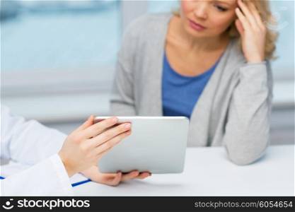 medicine, health care and people concept - close up of doctor with tablet pc computer and unhappy ill woman meeting at hospital