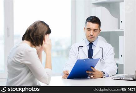 medicine, health care and people concept - doctor with clipboard and young woman meeting at hospital