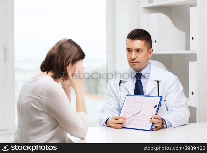 medicine, health care and people concept - doctor with clipboard and young woman meeting at hospital
