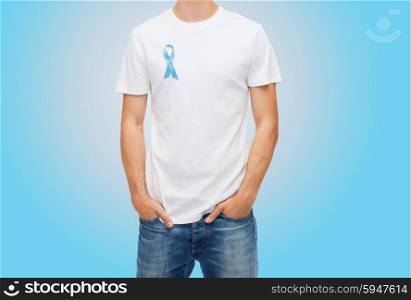 medicine, health care and people concept - man in t-shirt with blue prostate cancer awareness ribbon