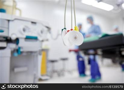 medicine, health care, electrocardiography, emergency and medical equipment concept - electrodes at hospital ward or operating room