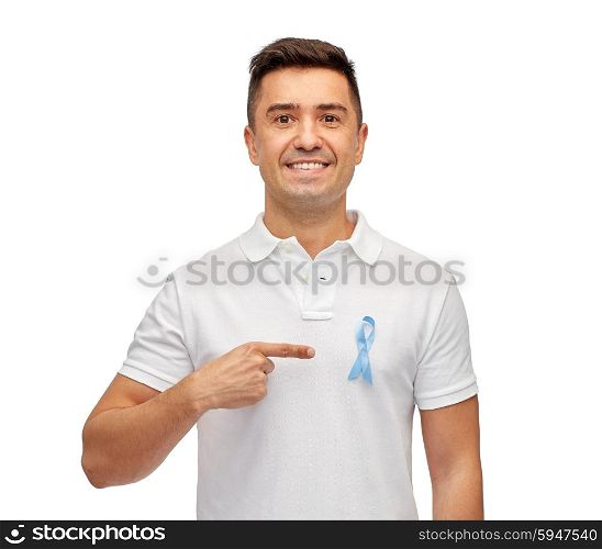medicine, health care, gesture and people concept - smiling middle aged latin man in t-shirt with blue prostate cancer awareness ribbon pointing finger on himself