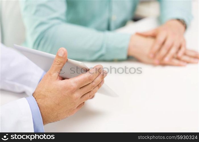 medicine, health care, people, prostate cancer and technology concept - close up of f male doctor and patient hands with tablet pc computer