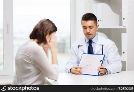 medicine, health, diagnosis care and people concept - doctor with clipboard and young woman meeting at hospital