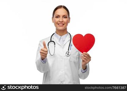 medicine, healthcare and cardiology concept - smiling female doctor with red heart and stethoscope showing thumbs up. smiling female doctor with heart showing thumbs up