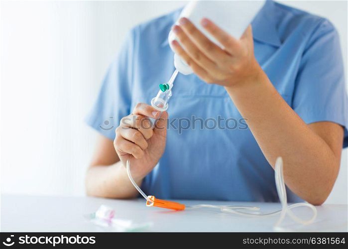 medicine, healthcare and people concept - close up of nurse preparing drop counter. close up of nurse preparing drop counter