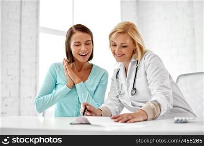 medicine, healthcare and people concept - doctor happy woman patient at hospital. doctor happy woman patient at hospital