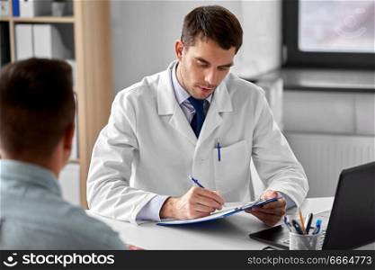 medicine, healthcare and people concept - doctor with clipboard and male patient at medical office in hospital. doctor with clipboard and male patient at hospital