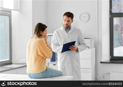 medicine, healthcare and people concept - male doctor with clipboard talking to scared or coughing woman patient at hospital. male doctor and coughing woman at hospital