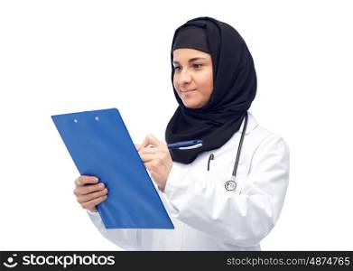 medicine, healthcare and people concept - smiling muslim female doctor wearing hijab and white coat with clipboard and stethoscope