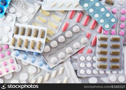 medicine, healthcare and pharmacy concept - different pills and capsules of drugs. different pills and capsules of drugs