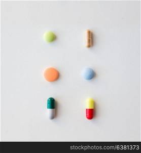 medicine, healthcare and pharmacy concept - different pills and capsules of drugs. different pills and capsules of drugs