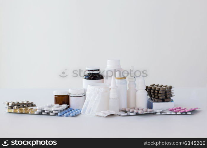 medicine, healthcare and pharmacy concept - packs of different pills and drugs. packs of different pills and medicine