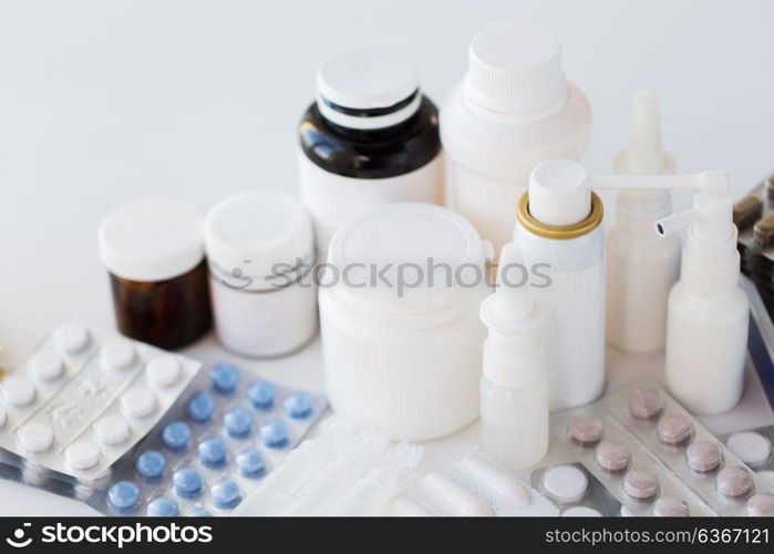 medicine, healthcare and pharmacy concept - packs of different pills and drugs. packs of different pills and medicine