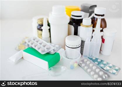 medicine, healthcare and pharmacy concept - packs of different pills and drugs. packs of different pills and medicine