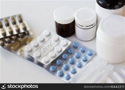 medicine, healthcare and pharmacy concept - packs of different pills and drugs. packs of different pills and medicine