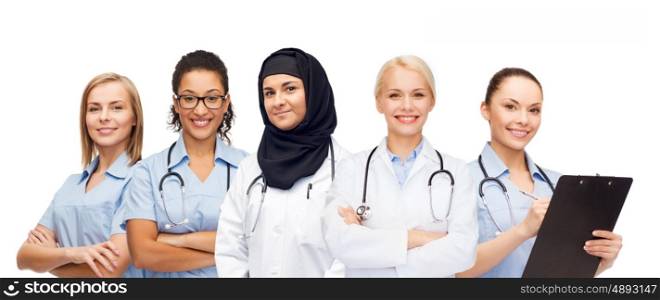medicine, healthcare, international and people concept - group of female doctors with stethoscopes and clipboard