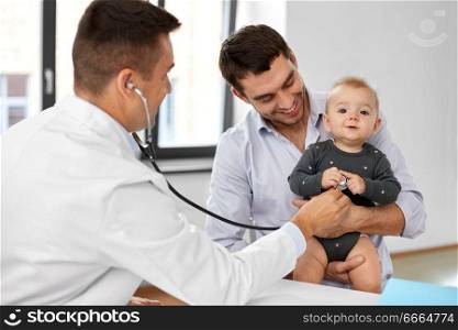 medicine, healthcare, pediatry and people concept - father with baby and doctor with stethoscope at medical office in hospital. father with baby and doctor at clinic