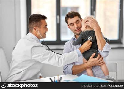 medicine, healthcare, pediatry and people concept - father with baby and doctor with stethoscope at medical office in hospital. father with baby and doctor at clinic