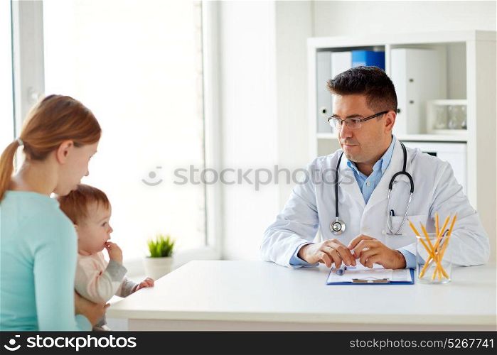 medicine, healthcare, pediatry and people concept - woman with baby and doctor at clinic. woman with baby and doctor at clinic
