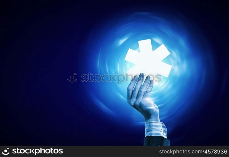 Medicine icon. Hand holding medicine sign on blue screen