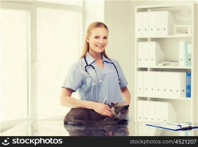medicine, pet, animals, health care and people concept - happy doctor or veterinarian with stethoscope checking british cat up at vet clinic