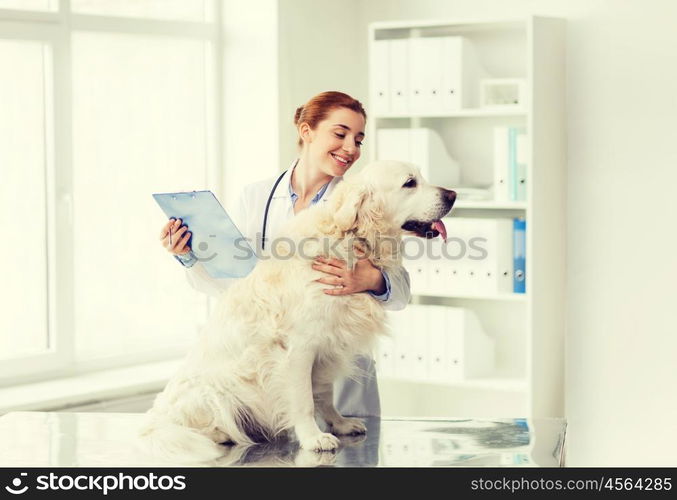 medicine, pet, animals, health care and people concept - happy veterinarian or doctor with golden retriever dog and clipboard at vet clinic