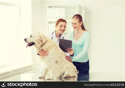 medicine, pet, health care, technology and people concept - happy woman with golden retriever dog and veterinarian doctor holding tablet pc computer at vet clinic