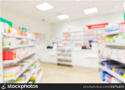 medicine, pharmacy, health care and pharmacology concept - pharmacy or drugstore room blurred background