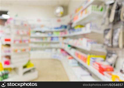 medicine, pharmacy, health care and pharmacology concept - pharmacy or drugstore room blurred background